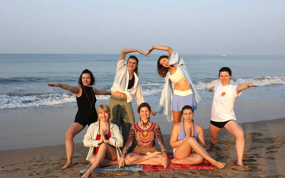 Purnam Yogashala students practising together on Agonda Beach, Goa